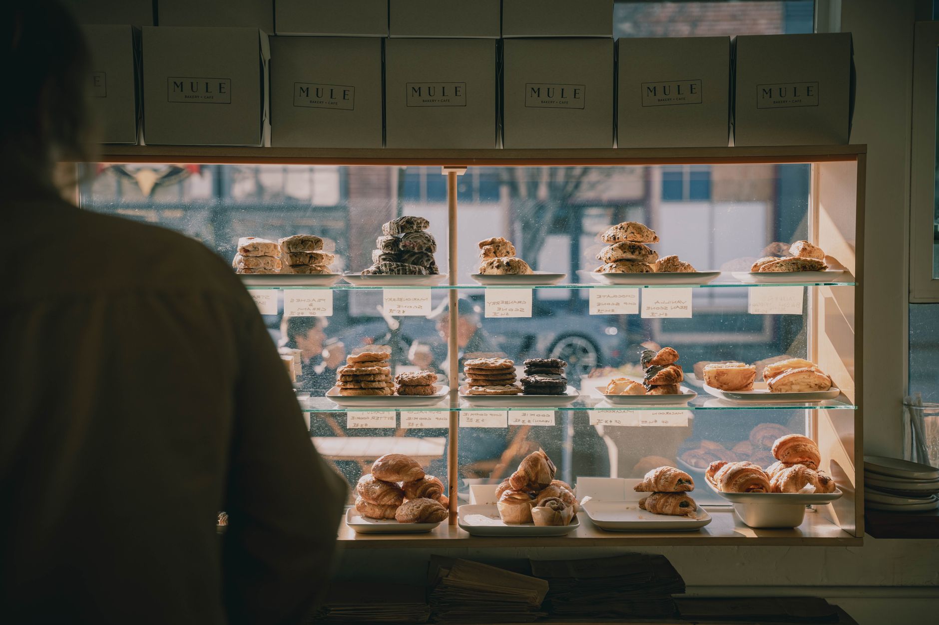 Bakery display case filled with pastries and baked goods