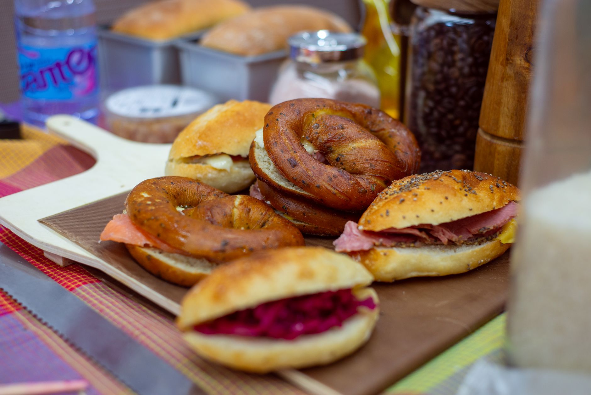 Assortment of fresh bagels with various fillings on display