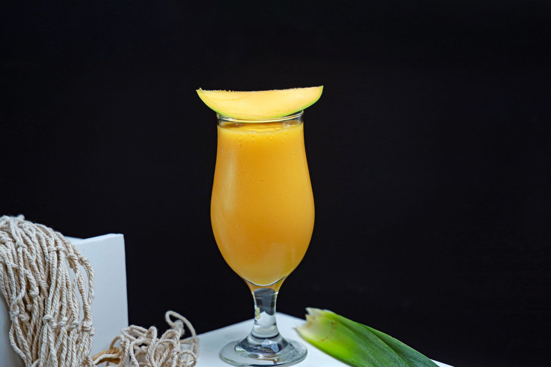 Fresh mango smoothie served in a glass